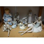 A German porcelain model of a baby 30cm; a Lladro model of a ballet dancer;