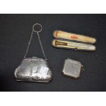 A silver purse, Birmingham hallmarks; a silver vesta case,