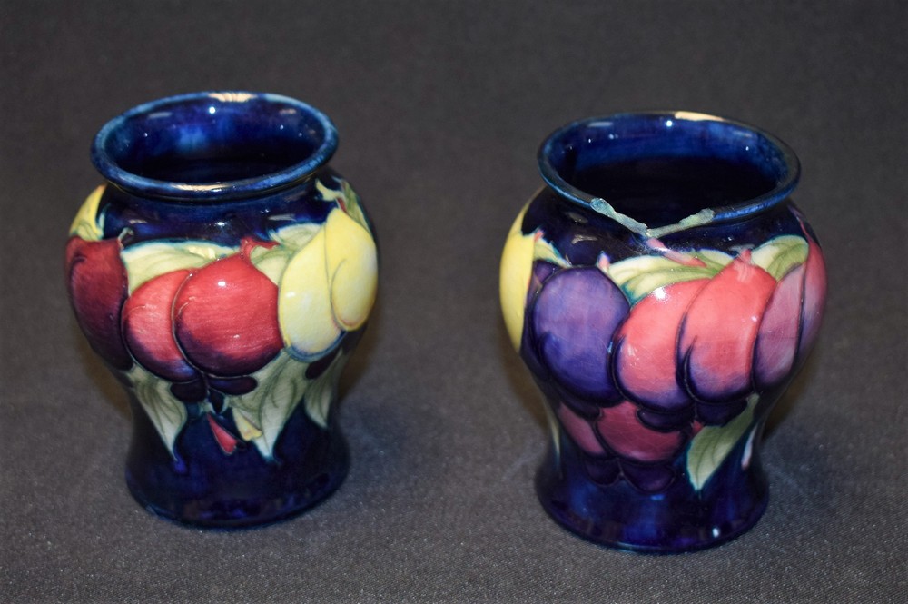 A pair of Moorcroft Wisteria pattern miniature inverted baluster vases, impressed marks, c.