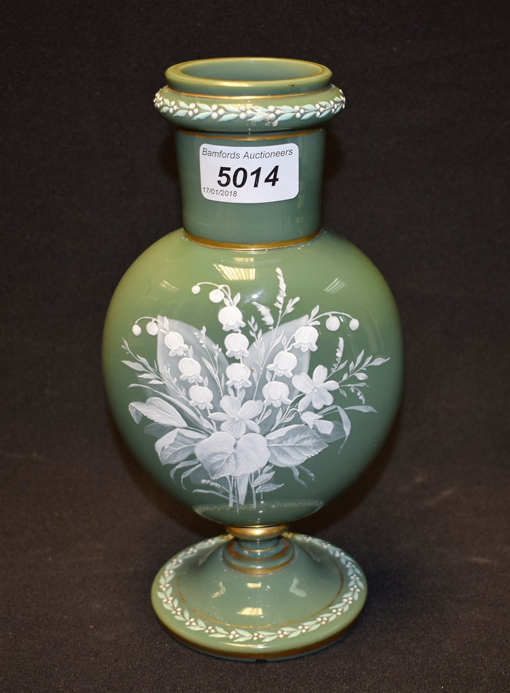 A 19th century pate sur pate green glass vase.