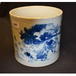 A Chinese cylindrical brush pot, painted in underglaze blue with scenes and figures from rural life,