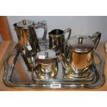 Old Hall - a Warwick hammered staybright stainless steel tea service comprising tea pot,