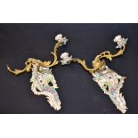 A pair of late 19th century ormolu and porcelain two light wall sconces,