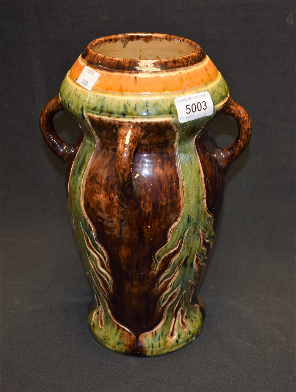 An Art Pottery four handled vase