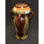 An Art Pottery four handled vase