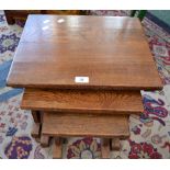 An oak nest of three tables