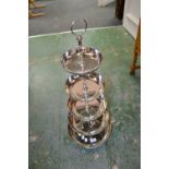 A chrome cake stand, five dished tiers.