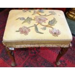 A 19th century walnut stool, crewel top,