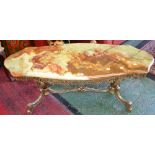A retro serpentine topped onyx and gilt metal coffee table