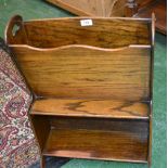 An early 20th century oak combination bookcase and magazine rack