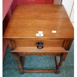 An oak side table single drawer to frieze, turned supports.