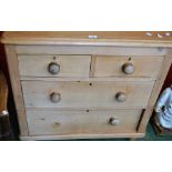 A pine chest of two short drawers over two long, 85cm high, 85cm wide,