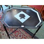 A modern metalwork tray top table