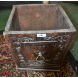 A 19th century carved oak log/coal box, tapering square body,