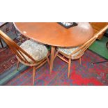 An Ercol blonde dropleaf table and four spindle back chairs (5)