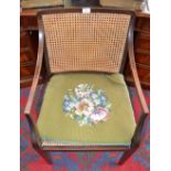 A George III Revival mahogany bergere library chair, c.