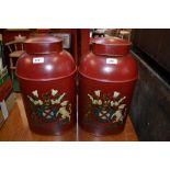 A pair of red Toleware tea tins