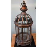 A pair of copper coloured lanterns