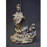 A Chinese figure of Guanyin upon waves, with Acolyte,