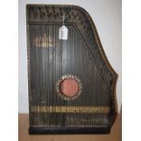 A 19th century black lacquered American guitar zither