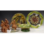 A majolica pedestal dish; an Art pottery slipware charger ,