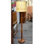 A mid 20th century mahogany standard lamp,