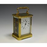 A French lacquered brass carriage timepiece