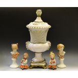 An Italian dressing table set; a pair of Nao figures;