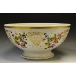 A French porcelain bowl, painted with colourful summer flowers and scrolls, 27.5cm diam, c.