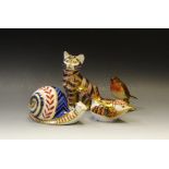 A Royal Crown Derby Garden Snail, ceramic stopper; a Royal Crown Derby seated Tabby,