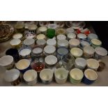 A quantity of ceramic and other egg cups to include Royal Crown Derby Posies, Cauldron Oriental,