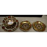 A Royal Crown Derby 1128 pattern teacup and saucer, a pair of 1128 five petal dishes,