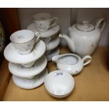 Ceramics - a KPM German porcelain tea service, comprising tea pot, six cups and saucers, cream jug,