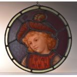A 19th century stained glass roundel, depicting a young boy in Renaissance dress,
