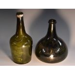 A 19th century green glass onion bottle, moulded in two sections, deep punt to base,