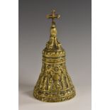 A 19th century Historocist brass bell, cast after a Medieval example with a row of figures,