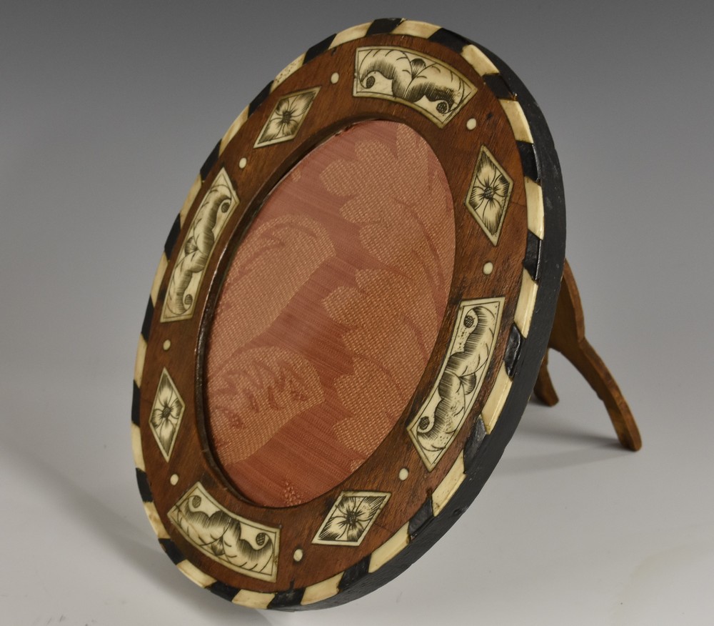 A 19th century Milanese hardwood and ivory marquetry oval picture frame,