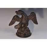 A 19th century cast iron door stop, as a spread eagle, demi-lune base, 18.