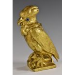 A 19th century bronze novelty inkwell, cast as a cockatoo, the head hinged as a cover, glass eyes,