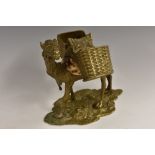 An unusual 19th century gilt bronze and cowrie shell novelty table vesta, cast as a saddled camel,