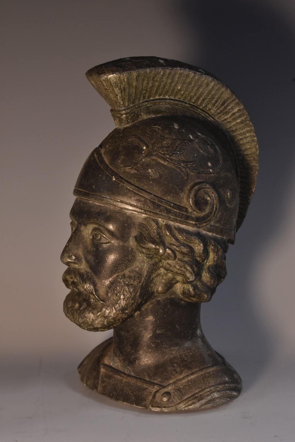 A 19th century weighted spelter bust, probably a door stop, cast as the head of a Classical soldier,