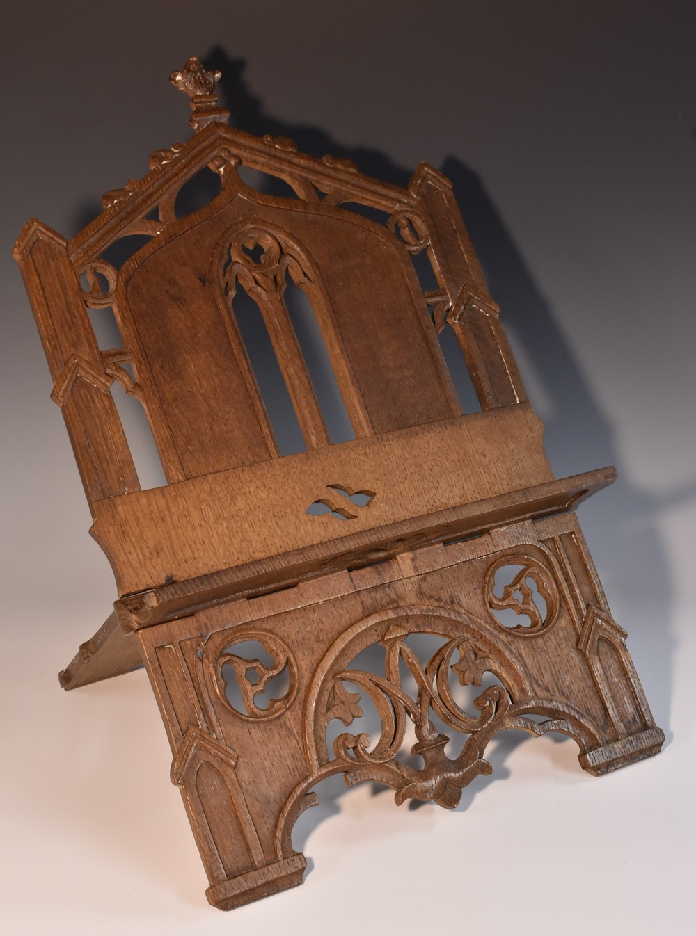 A 19th century Gothic Revival oak folding table lectern, pierced and carved with tracery, 41.