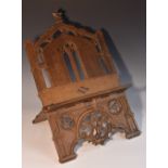 A 19th century Gothic Revival oak folding table lectern, pierced and carved with tracery, 41.