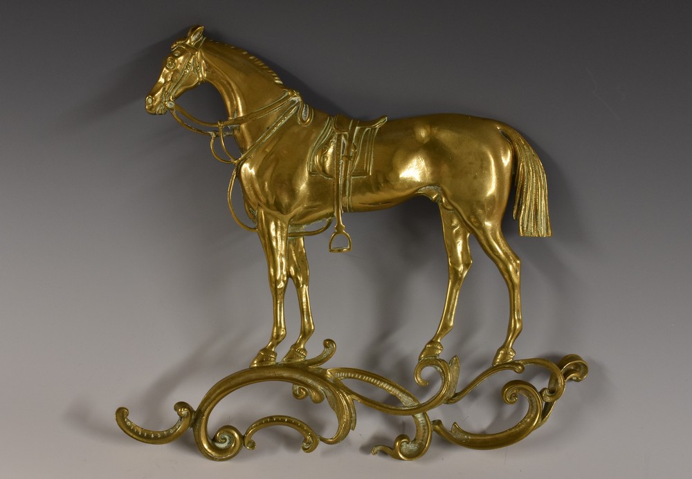 A 19th century gilt brass wall plaque, cast as a horse, 25cm high, c.