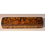 A 19th century Persian penwork qalamdan pen box, profusely decorated in polychrome with figures,