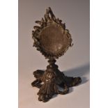 A 19th century dark patinated bronze pocket watch stand, cast throughout with acanthus,