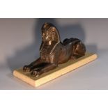 French School (19th/early 20th century), a dark patinated metal model, of a Sphinx, marble base,