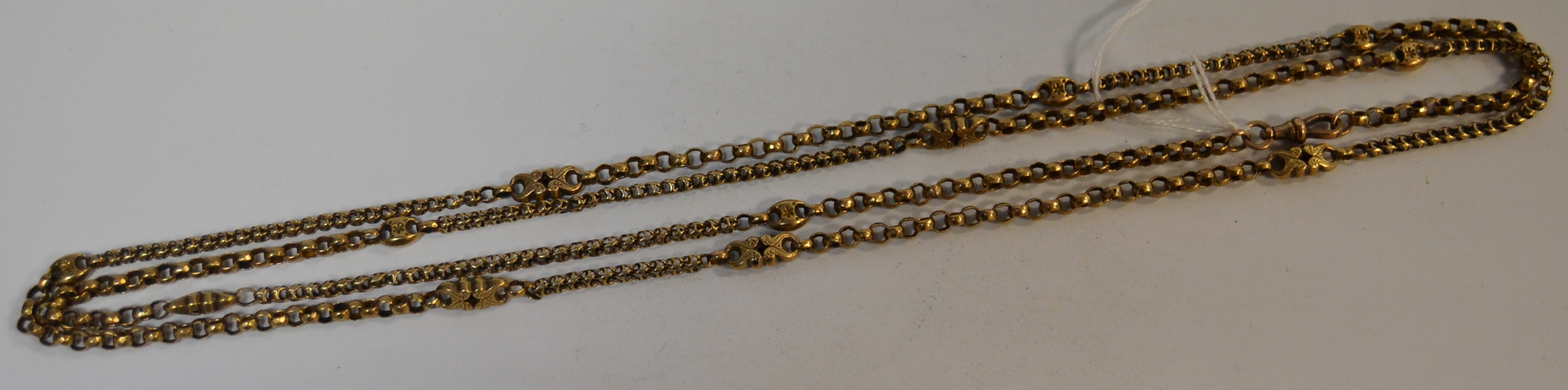 A Victorian/Edwardian 9ct gold fancy link muff chain, 136cm long,