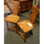 A pair of North Country Oak carved spinning chairs, carved splat,