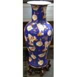 A substantial Japanese Satsuma type temple vase, decorated with Geishas in various landscape scenes,